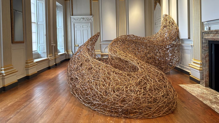 A large flowing willow sculpture in a grand historic Saloon